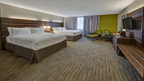 A hotel room with two beds, a desk, a chair, a TV, and a large window with curtains. - Holiday Inn Express Louisville Airport Expo Center by IHG (Louisville)