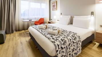 Premium bedding, down comforters, pillowtop beds, minibar