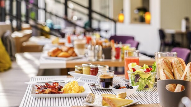 A breakfast buffet with various food items and beverages.
