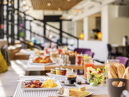 A breakfast buffet with various food items and beverages.. Mercure Marseille Centre Prado Vélodrome