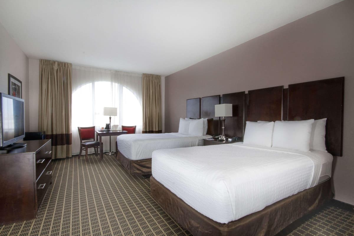 Premium bedding, in-room safe, laptop workspace, soundproofing
