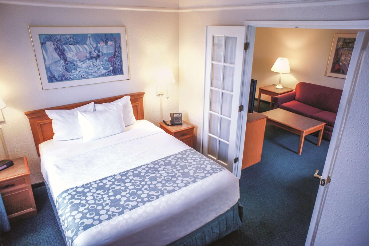 Premium bedding, desk, laptop workspace, iron/ironing board