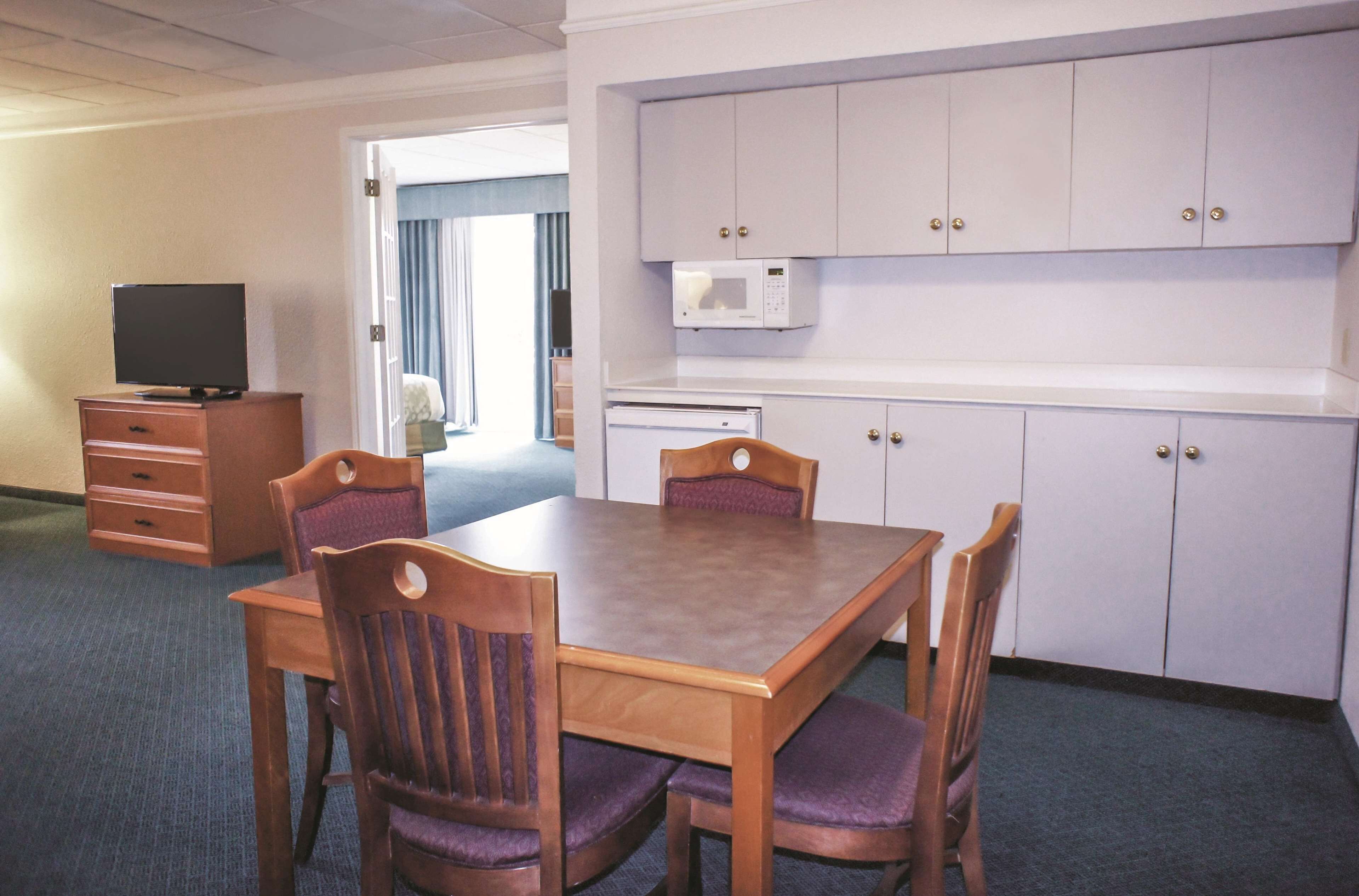 deluxe suite, 1 king bed, non smoking (deluxe family suite) | premium bedding, desk, laptop workspace, iron/ironing board