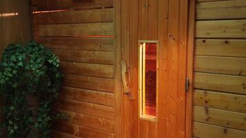 A wooden cabin with a door that has a small window.