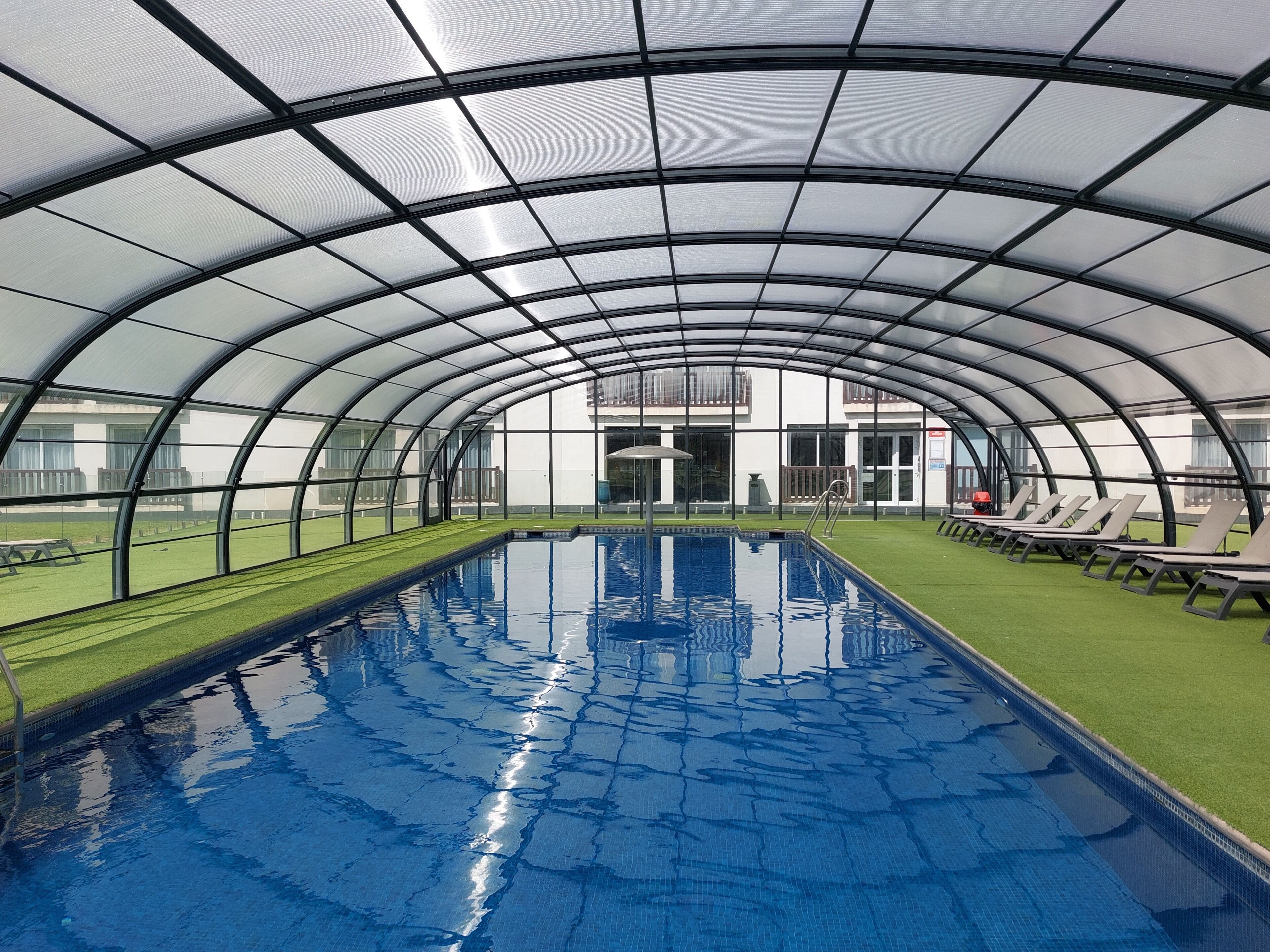 Indoor pool, outdoor pool, open 10:00 AM to 8:00 PM, pool umbrellas