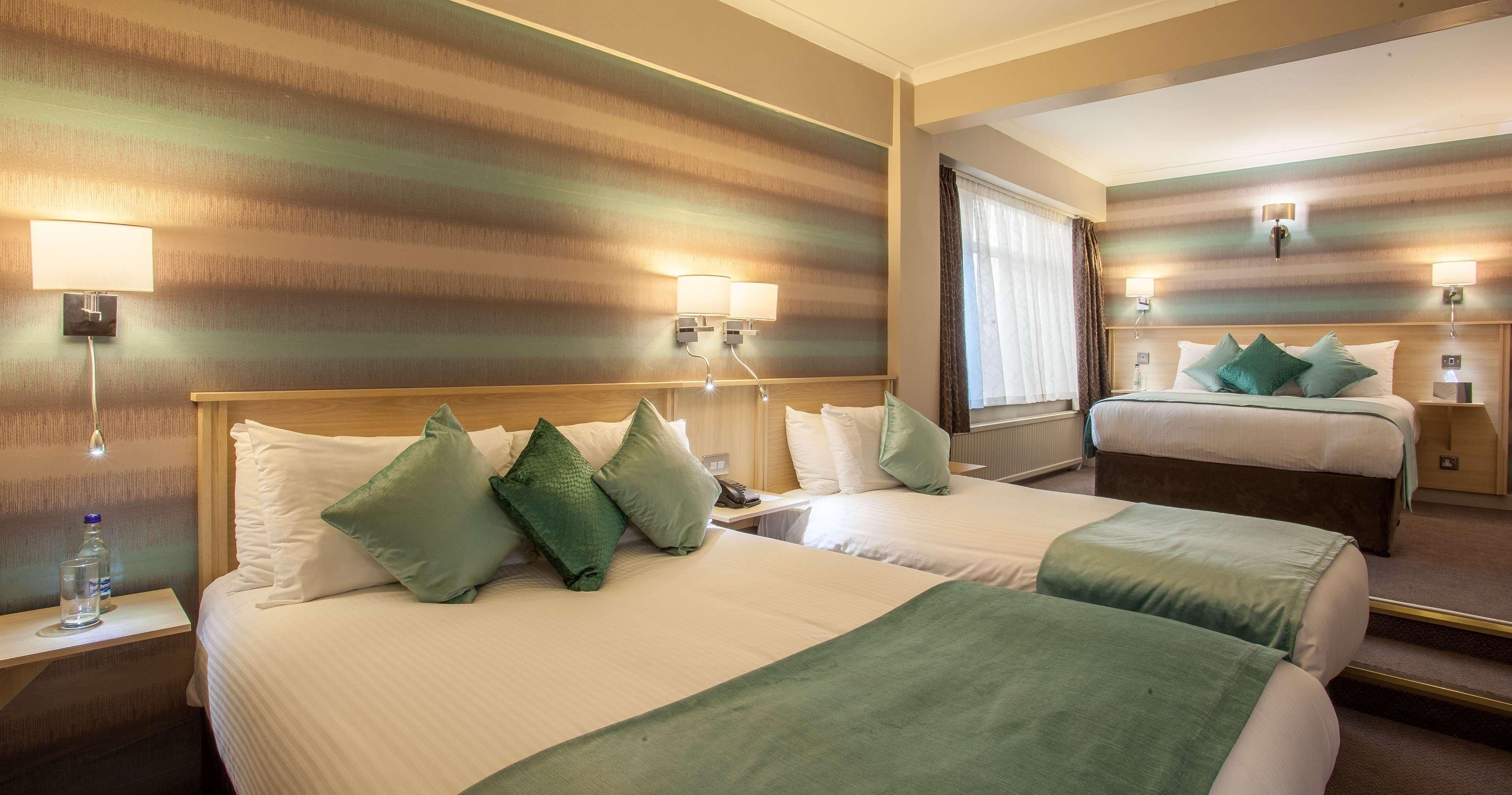 Desk, laptop workspace, iron/ironing board, free cots/infant beds