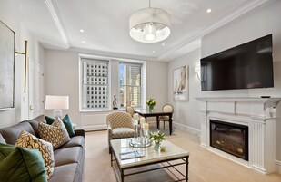 Suite, City View | Living room | 50-inch flat-screen TV with cable channels, iPod dock