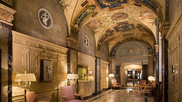 An ornate lobby with a high ceiling, detailed frescoes, and classical architecture. - The Sherry Netherland (New York)