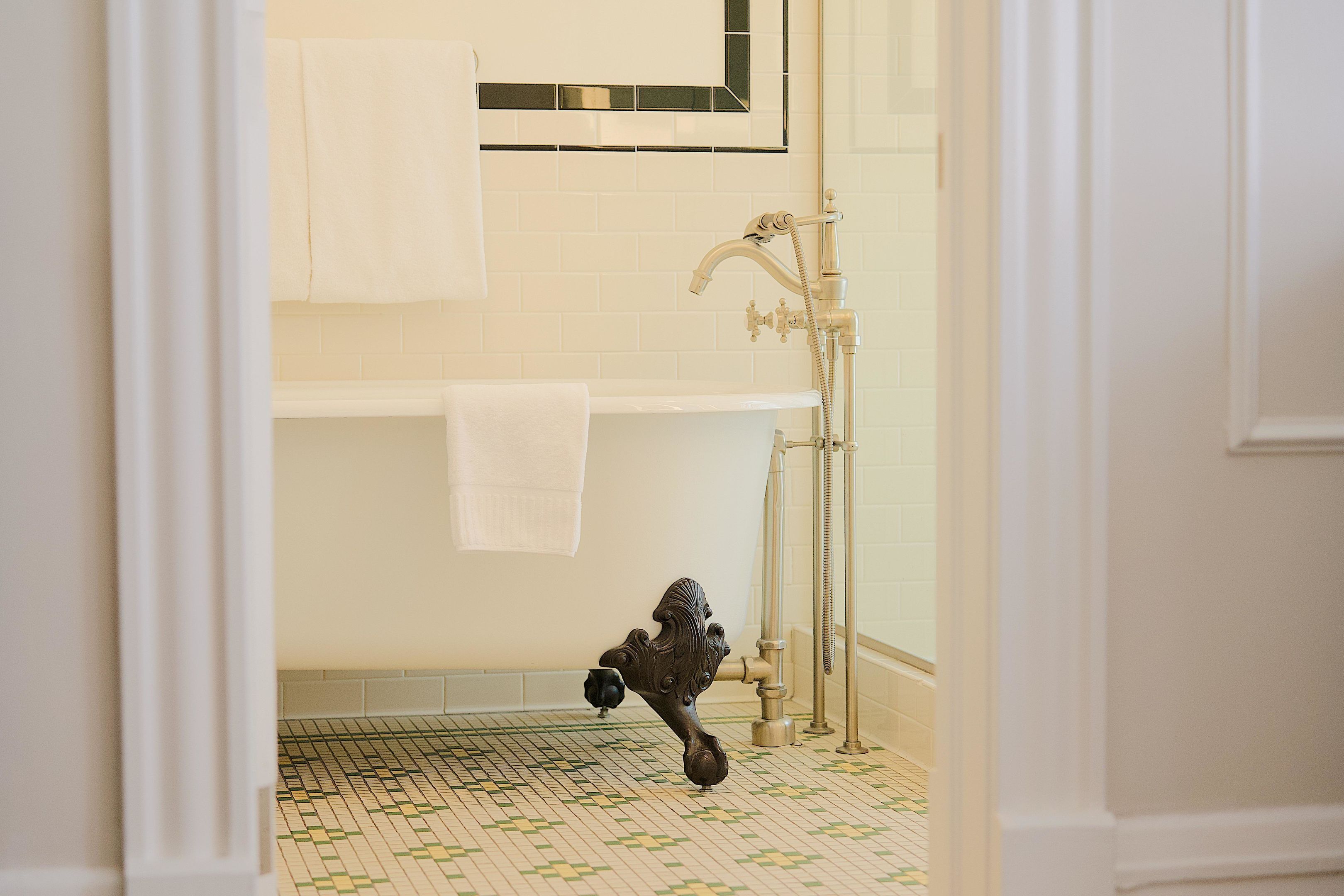 A bathroom with a bathtub, a shower, and a toilet.