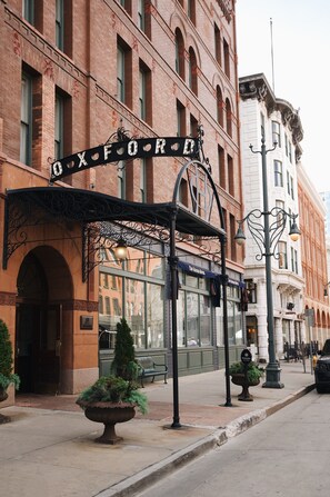 A hotel entrance with a sign reading "OXFORD HOTEL" and a covered entrance area. - The Oxford Hotel (Denver)