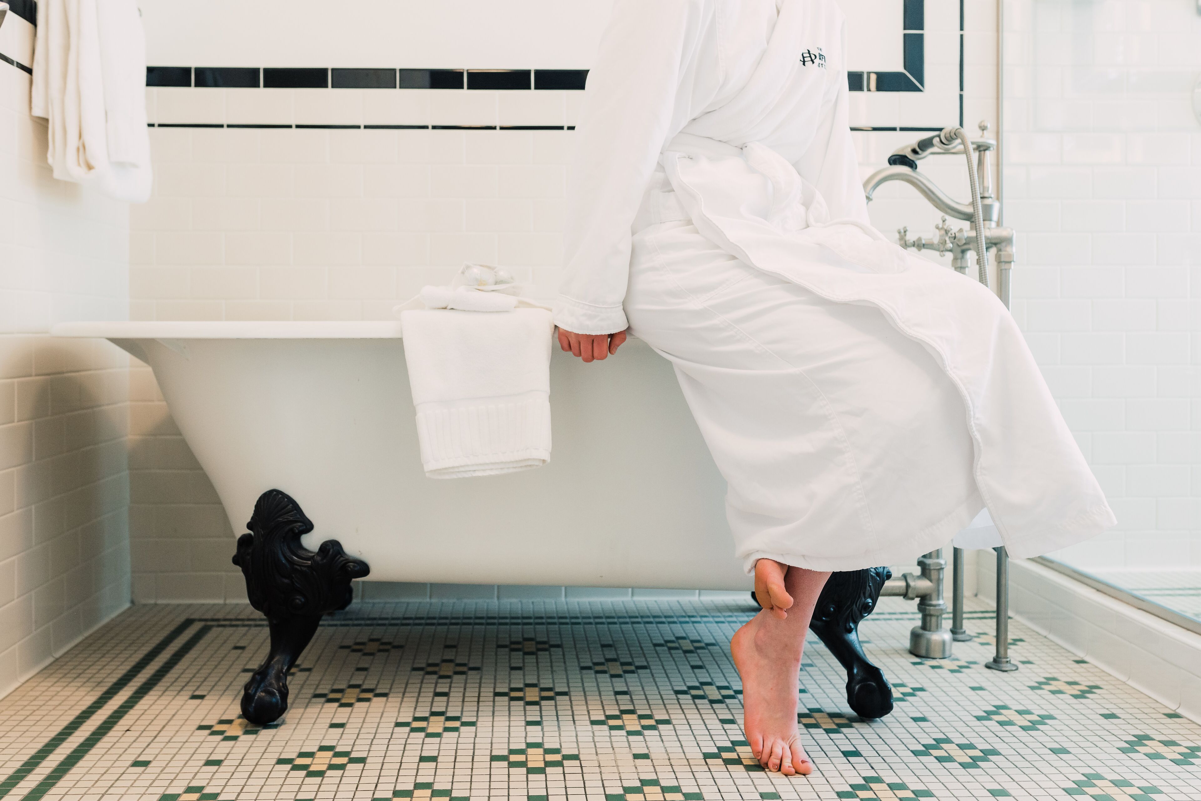 combined shower/bathtub, designer toiletries, hair dryer, bathrobes