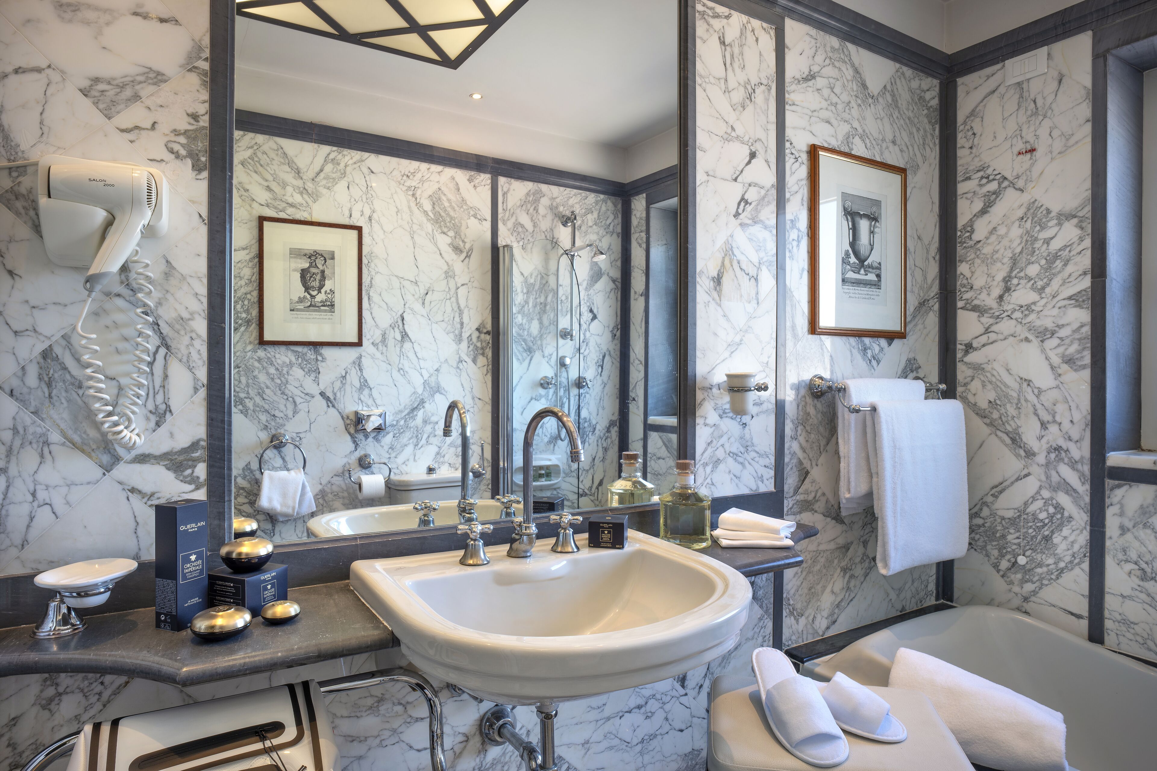 combined shower/bathtub, designer toiletries, hair dryer, slippers