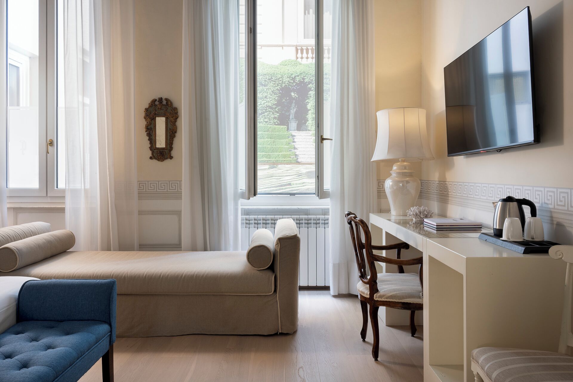 classic triple room, 1 double bed with sofa bed, courtyard view | view from room