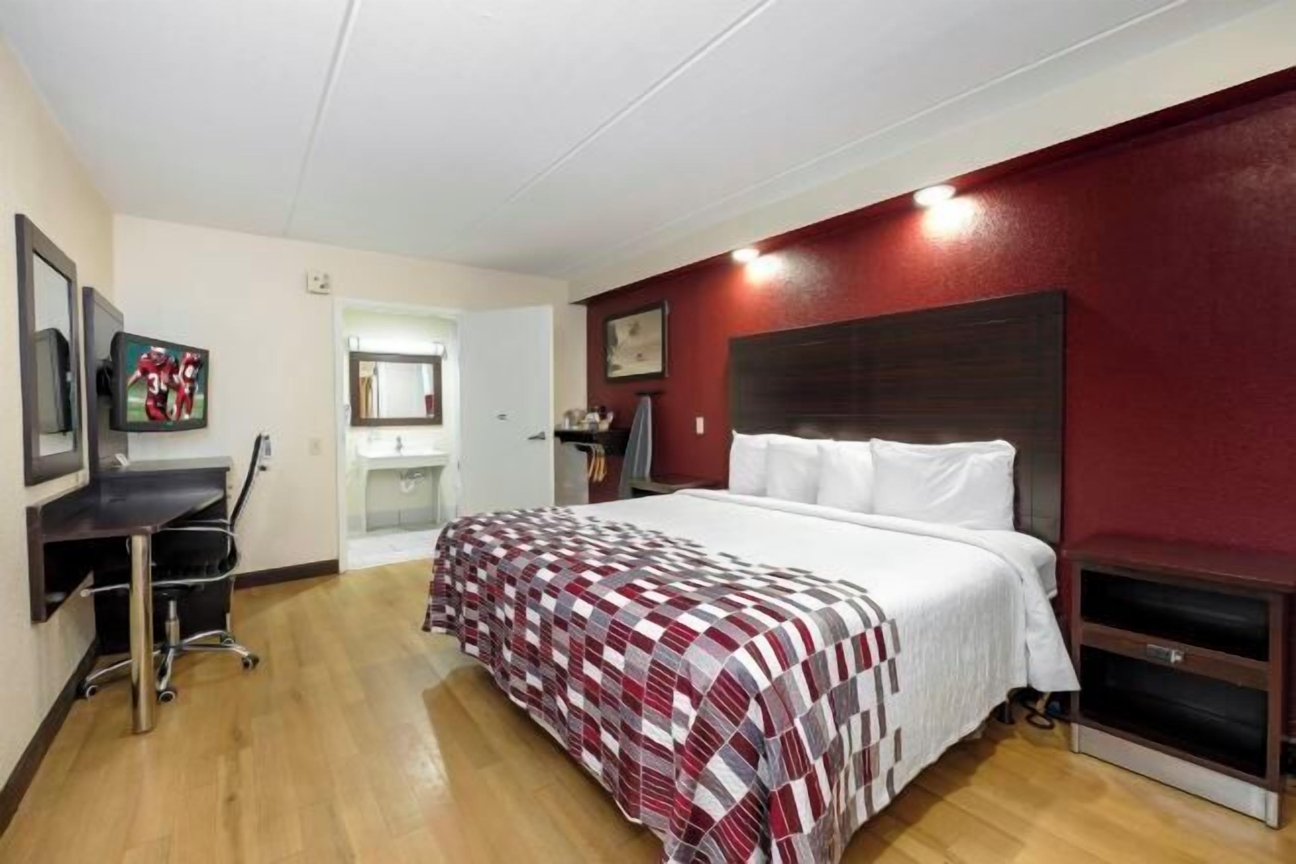 Desk, laptop workspace, blackout drapes, iron/ironing board