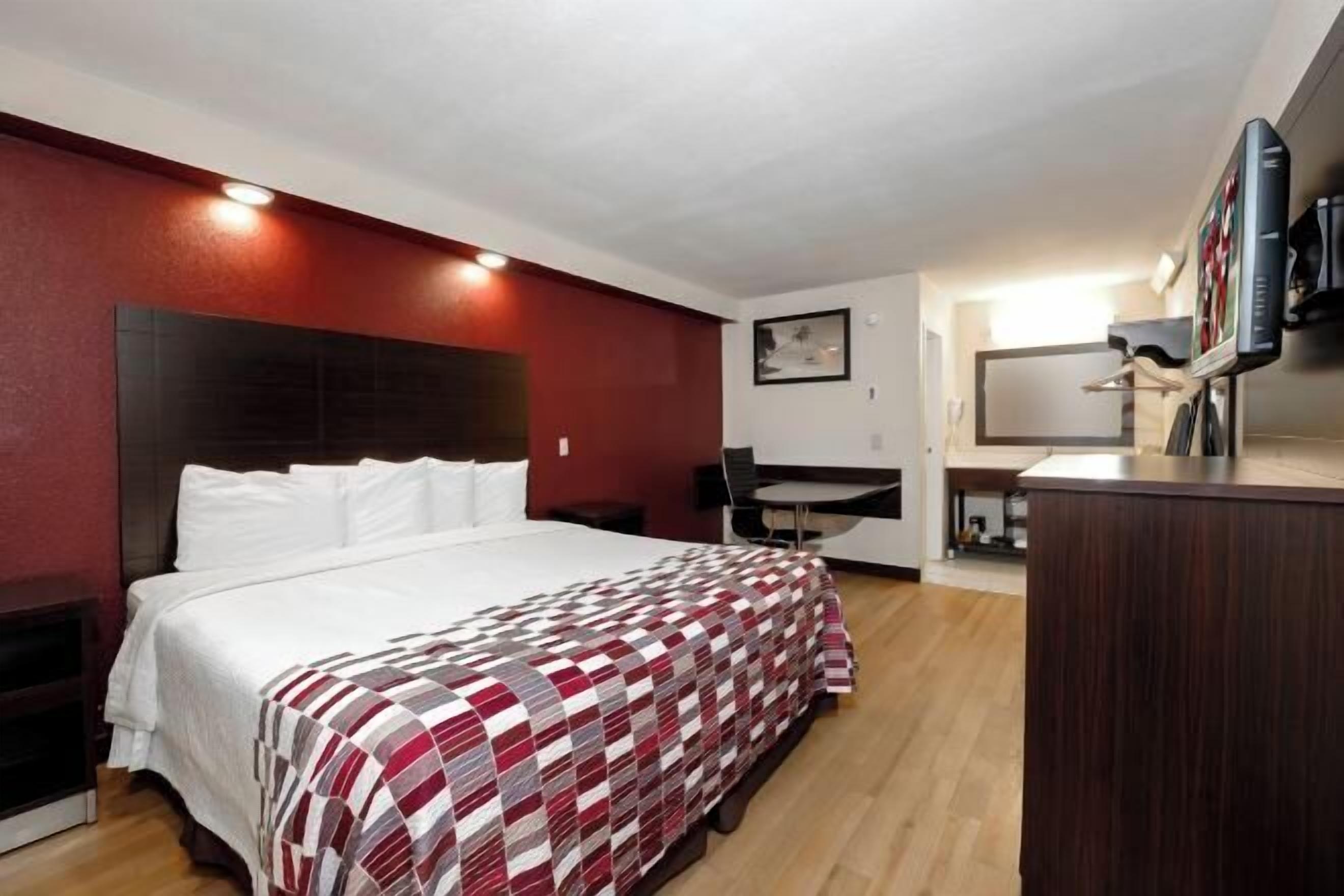 Desk, laptop workspace, blackout drapes, iron/ironing board