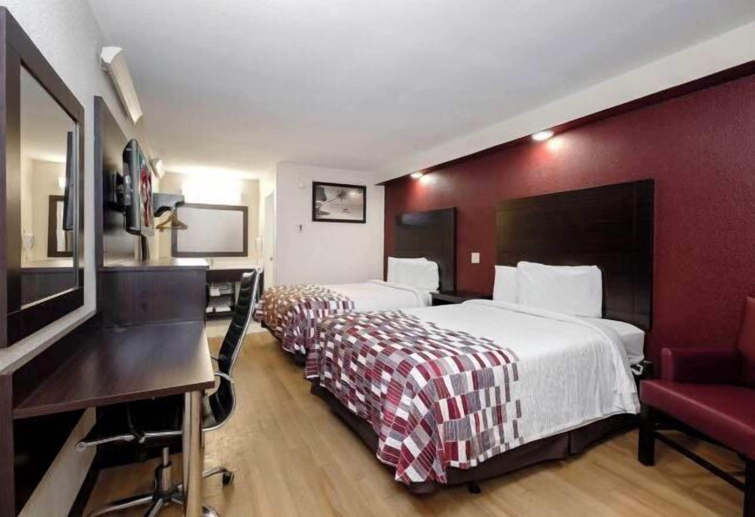 Desk, laptop workspace, blackout drapes, iron/ironing board