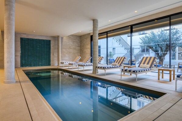 Indoor pool, seasonal outdoor pool, pool umbrellas, pool loungers