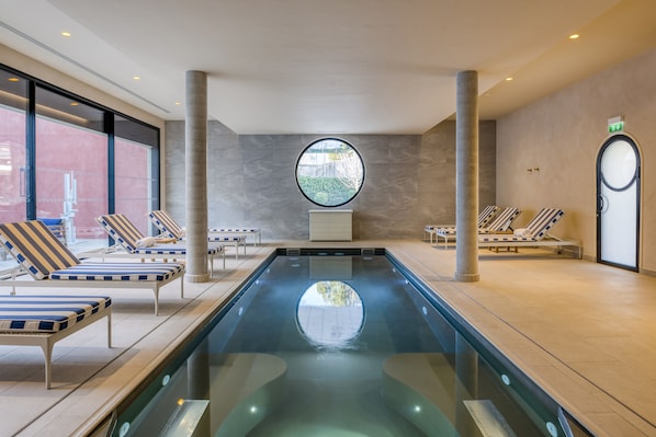 Indoor pool, seasonal outdoor pool, pool umbrellas, pool loungers