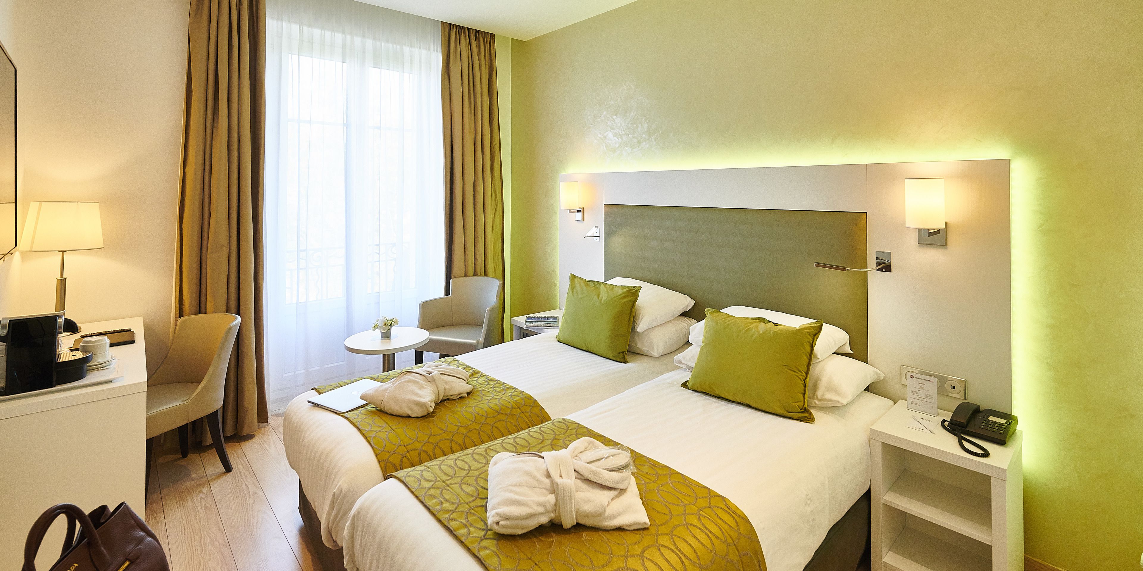 comfort room, 2 single beds, non smoking | minibar, in-room safe, individually decorated, desk
