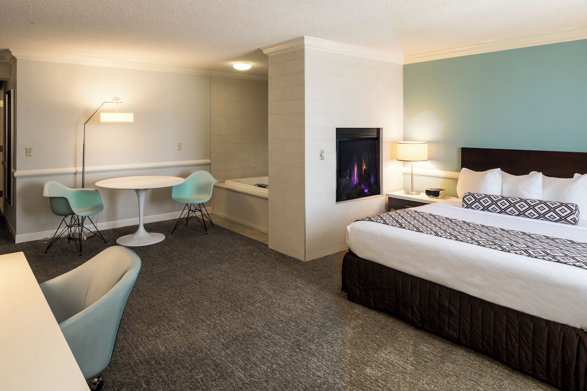 Hypo-allergenic bedding, desk, laptop workspace, blackout curtains