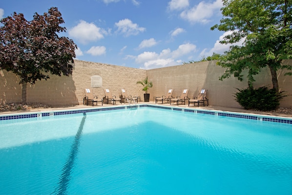 Seasonal outdoor pool, open 9:00 AM to 5:00 PM, pool loungers