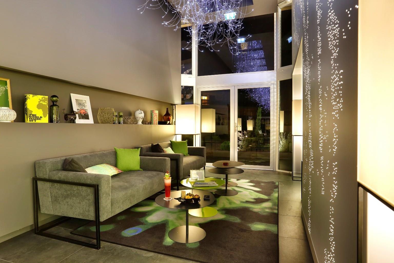 A modern living room with a sofa, coffee table, and decorative items.