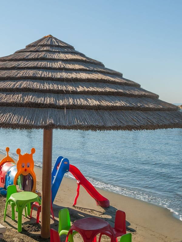 On the beach, sun-loungers, beach umbrellas, beach towels