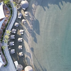 On the beach, sun-loungers, beach umbrellas, beach towels
