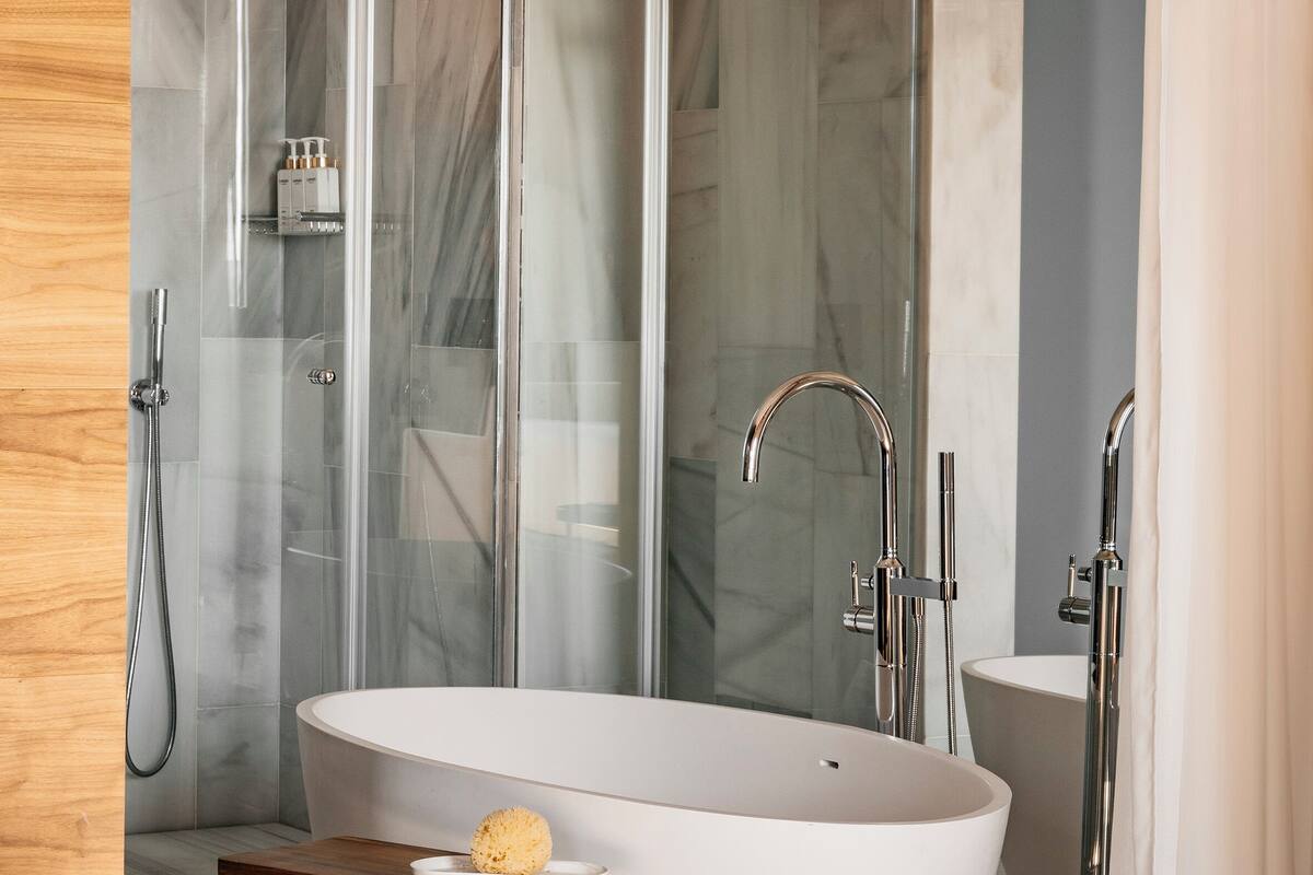 junior suite red level cathedral view | bathroom | designer toiletries, hair dryer, bathrobes, slippers