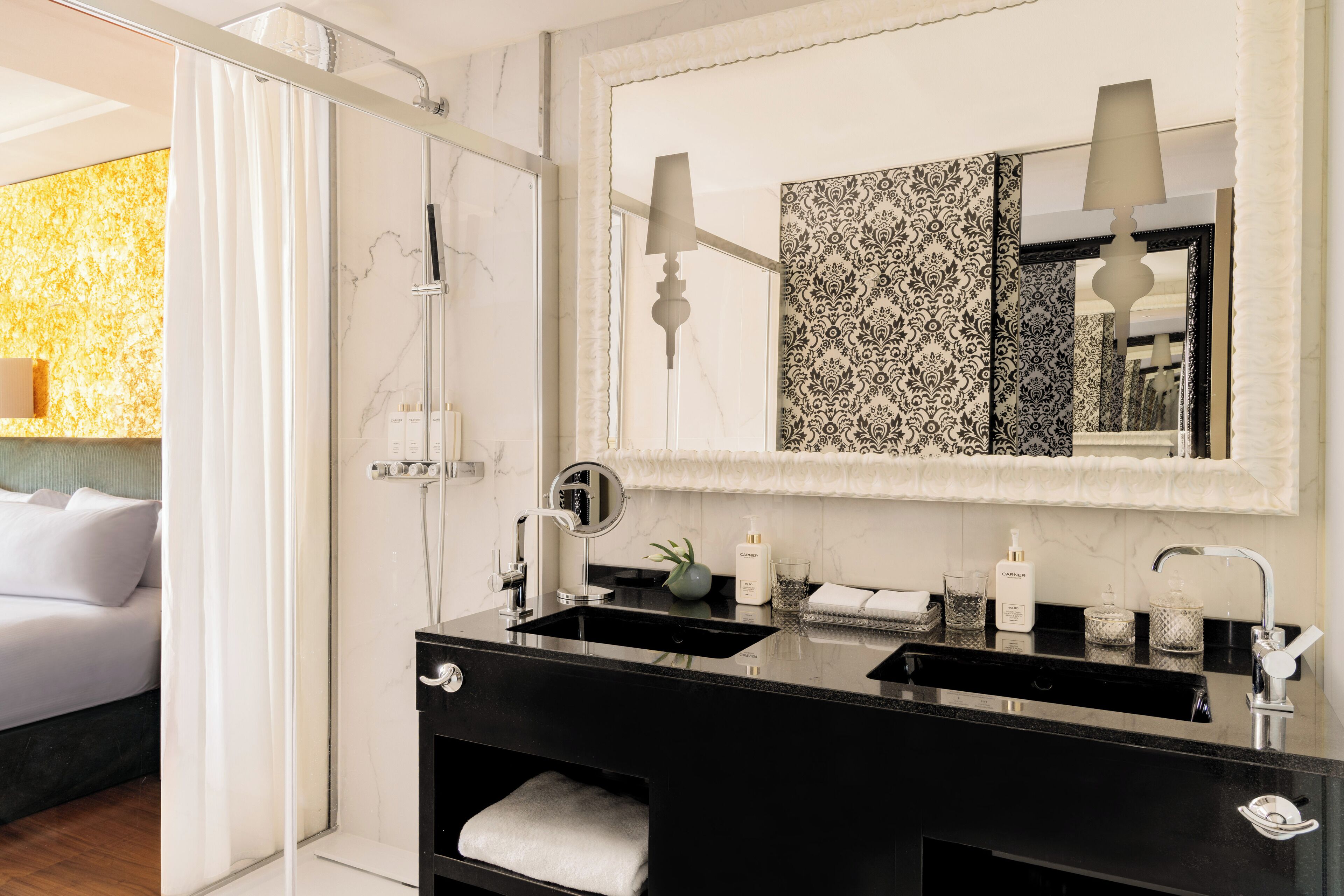 designer toiletries, hair dryer, bathrobes, slippers