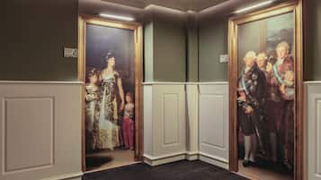 A hallway with two doors, each leading to a room.