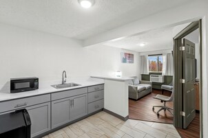 Suite, 2 Double Beds | Desk, blackout drapes, iron/ironing board, free cribs/infant beds