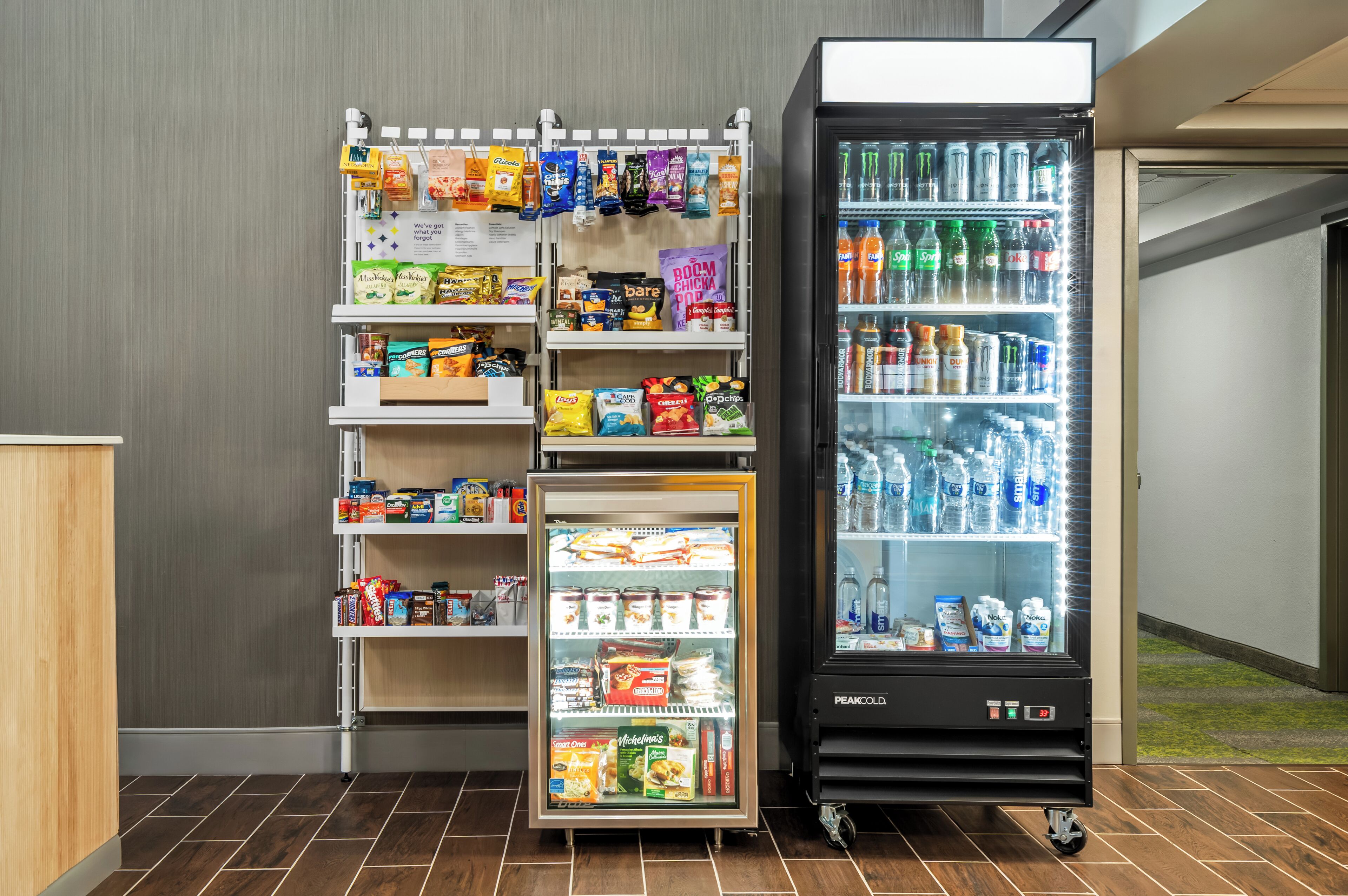 A vending machine with snacks and a refrigerator stocked with beverages.
