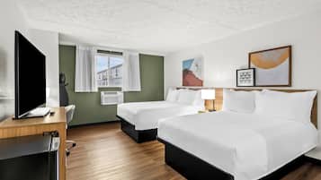 Desk, blackout drapes, iron/ironing board, free cribs/infant beds