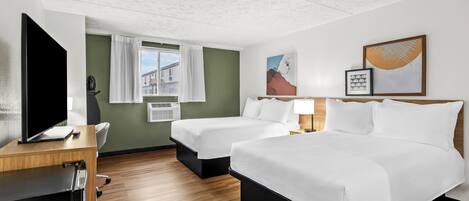 Desk, blackout drapes, iron/ironing board, free cribs/infant beds