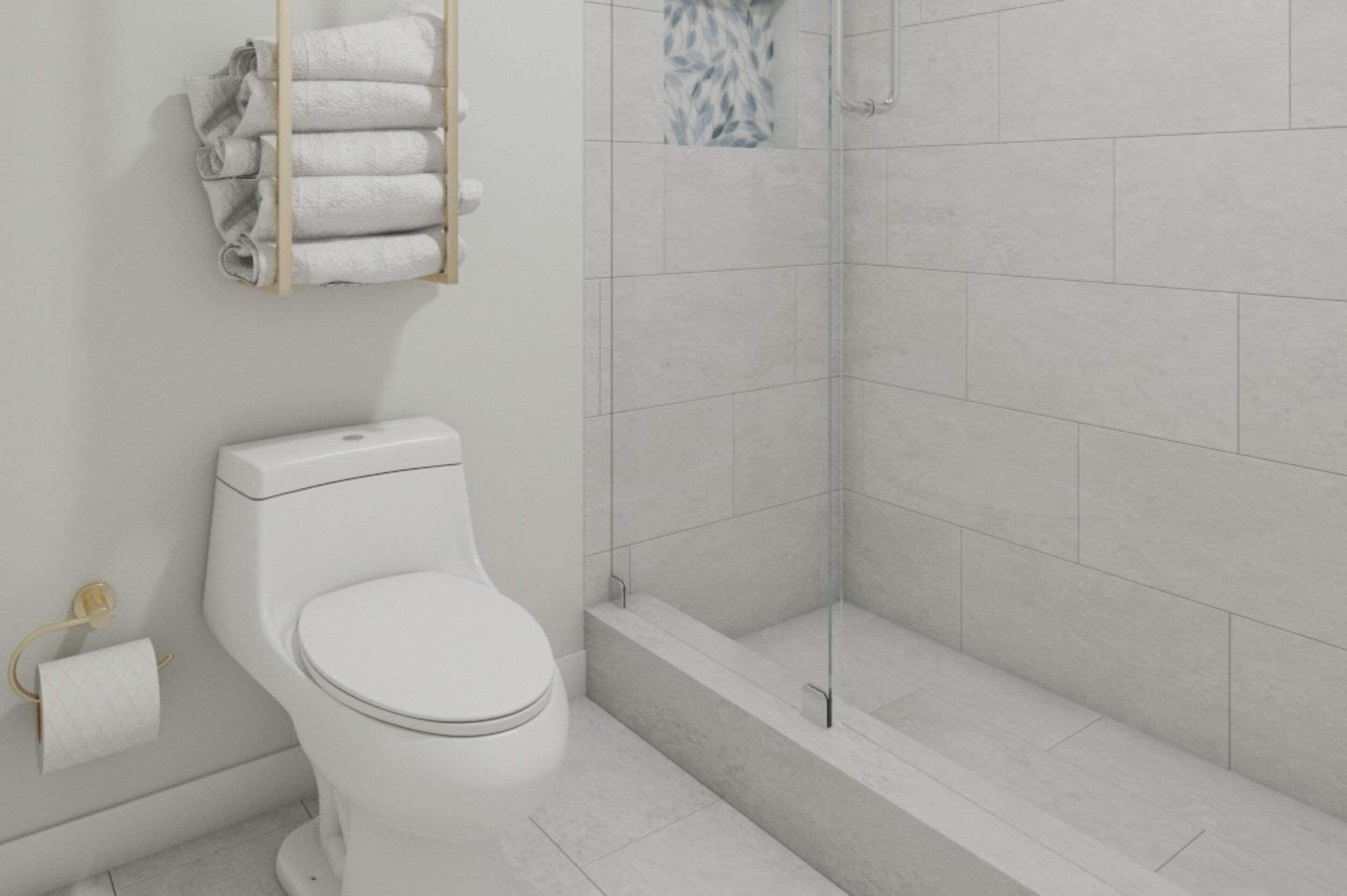 A modern bathroom with a toilet, a glass shower enclosure, and a towel rack.