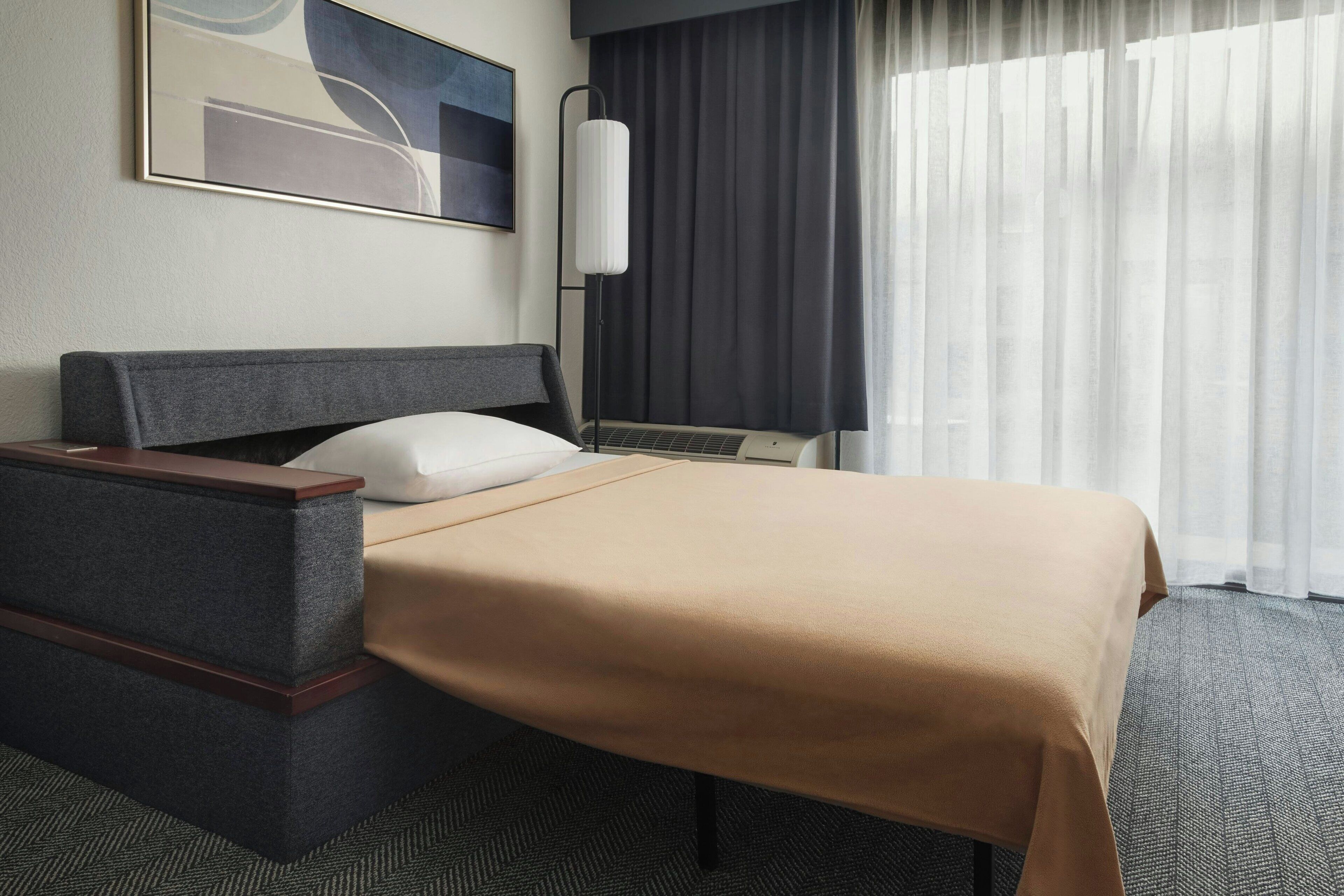 premium bedding, desk, laptop workspace, iron/ironing board