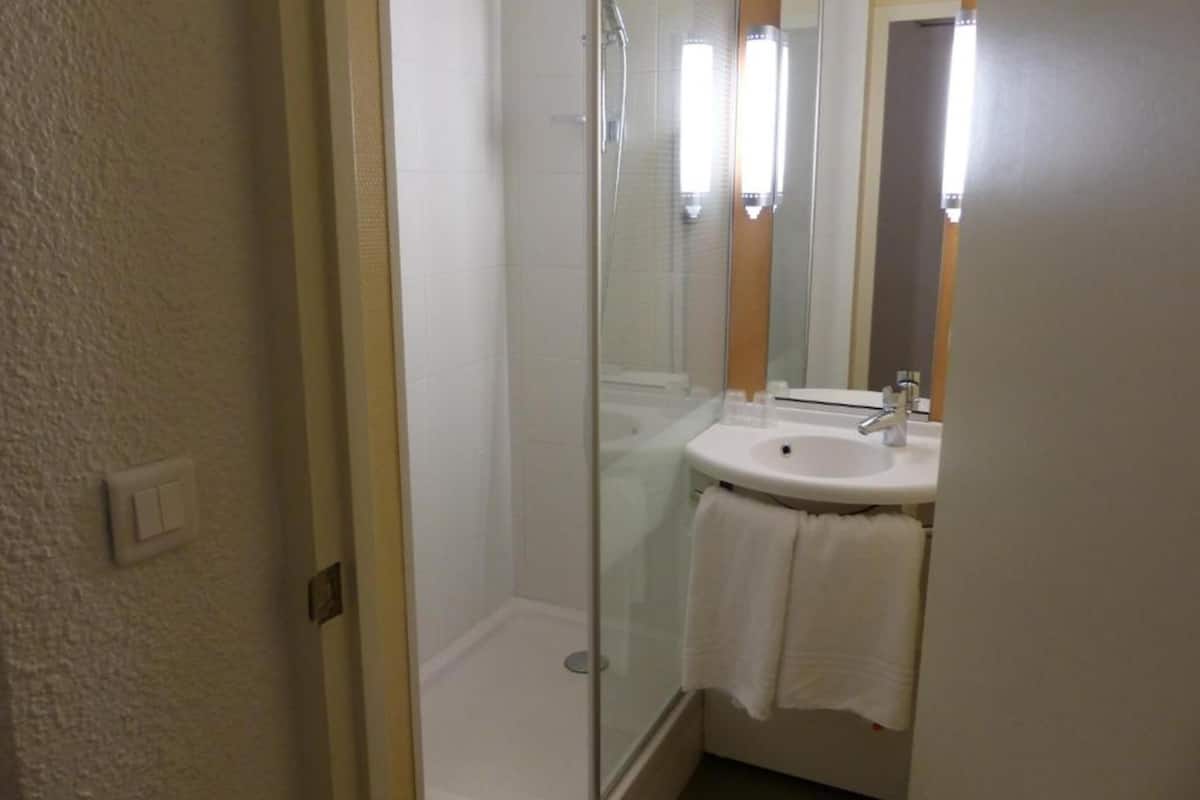 shower, eco-friendly toiletries, hair dryer, towels