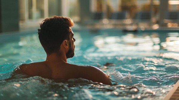 Seasonal outdoor pool, open 10:00 AM to 8:00 PM, pool umbrellas