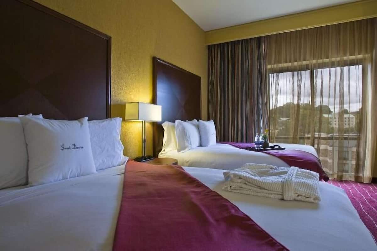 Premium bedding, down comforters, pillowtop beds, minibar