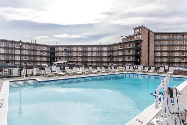 Outdoor pool, open 8:00 AM to 10 PM, pool loungers