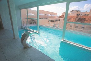 Indoor pool, seasonal outdoor pool, pool umbrellas, pool loungers