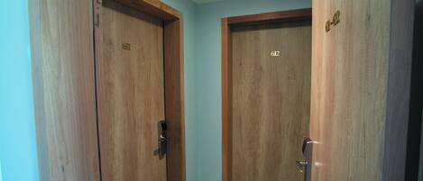 Two wooden doors with numbers 611 and 612, indicating room numbers.
