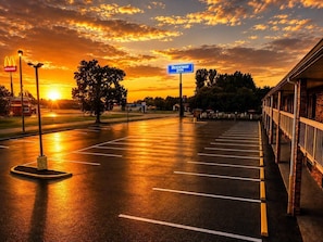 A parking lot with a McDonald's and a sign for Rodeway Inn. - Rodeway Inn Expo Center (Spartanburg)