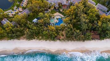 On the beach, white sand, beach towels, beach massages