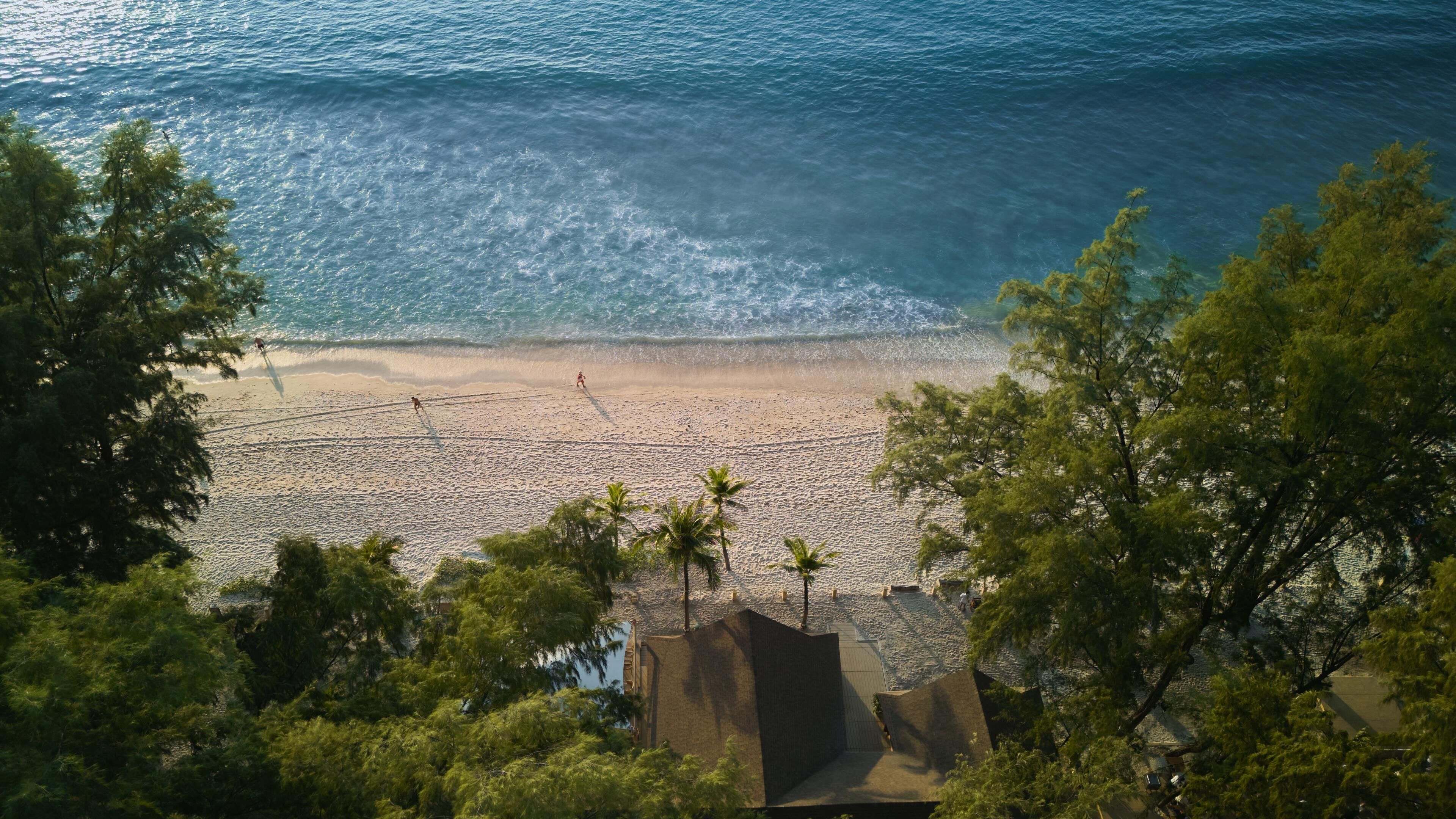 On the beach, white sand, beach towels, beach massages