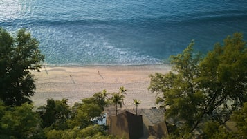 On the beach, white sand, beach towels, beach massages