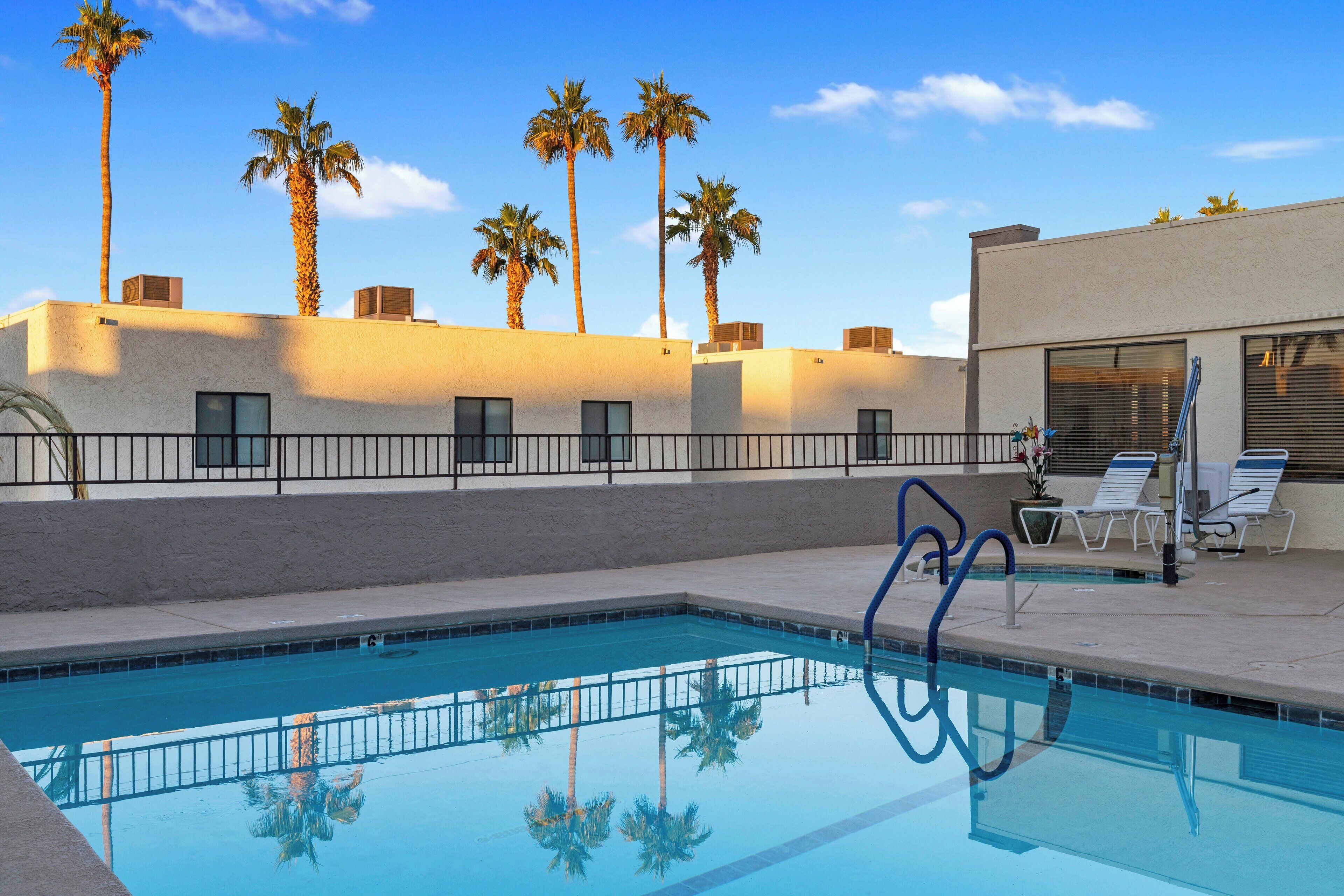 outdoor pool, open 7:00 am to 10:00 pm, pool umbrellas, pool loungers