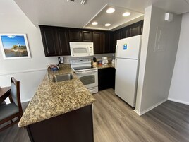 Condo, 2 Bedrooms, Kitchen | Private kitchen | Shared fridge, microwave, coffee/tea maker, toaster