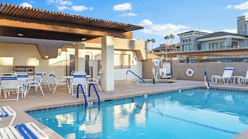 Outdoor pool, open 7:00 AM to 10:00 PM, pool umbrellas, pool loungers